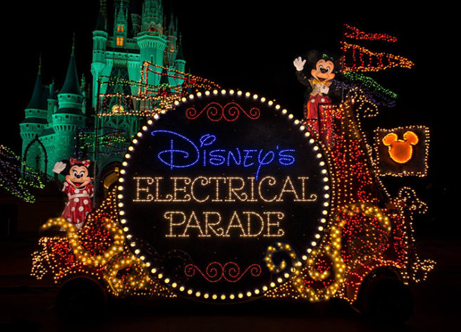 Mickey and Minnie Mouse on top of Disney's Main Street Electrical Parade float.