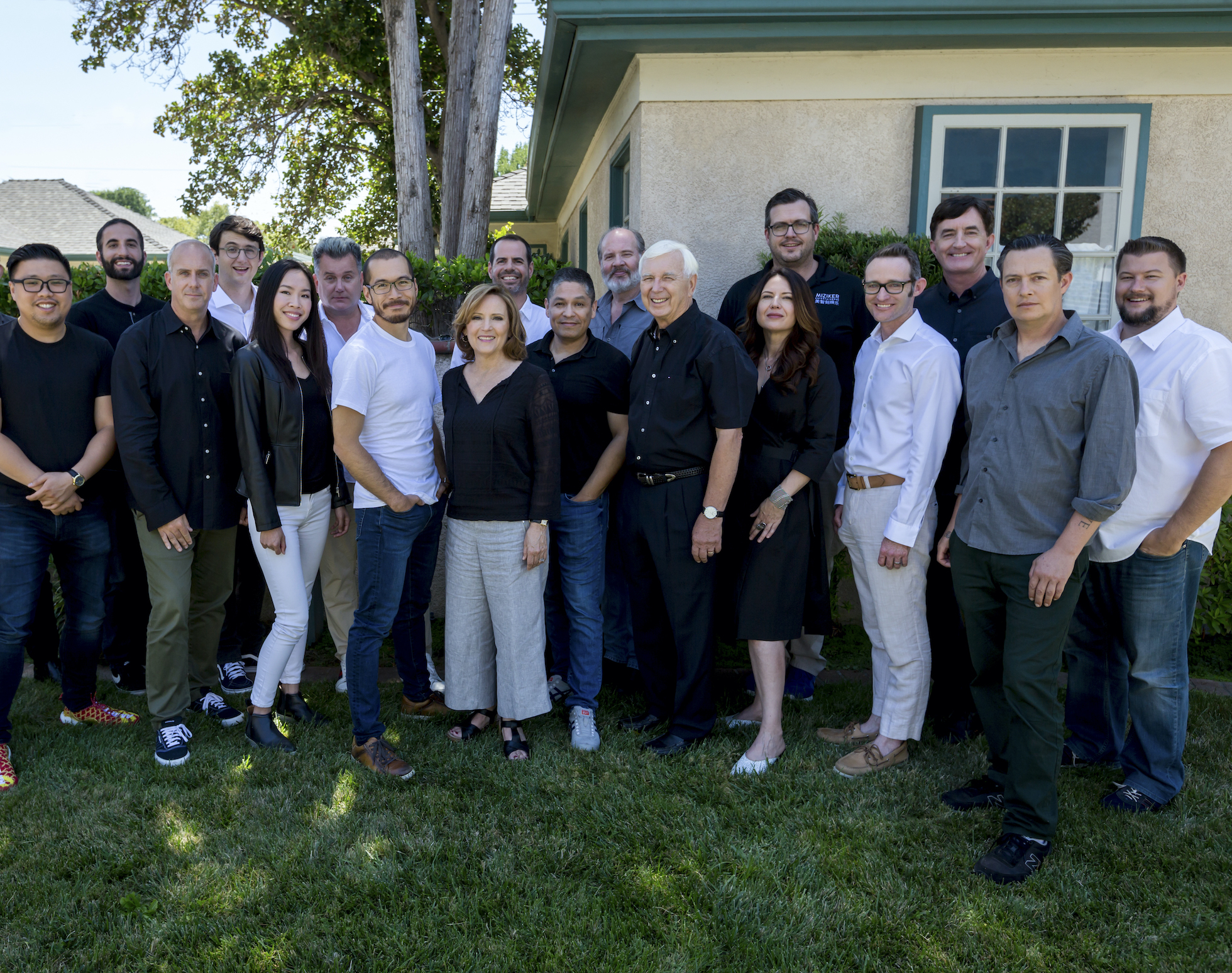 The Miziker Team pictured in front of their offices.