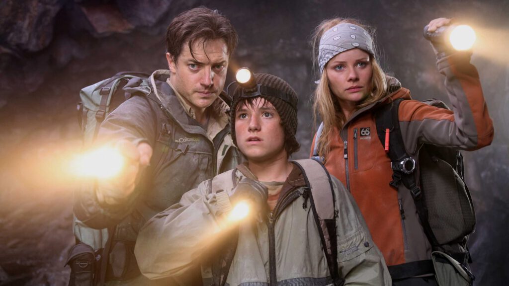 Brendan Fraiser and his two supporting cast mates in a poster for Journey to the Center of the Earth, produced by Charlotte Huggins of Miziker